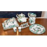 A Mason’s Ironstone “Chartreuse” patter dinner service, in green and gilt, including 6 dinner