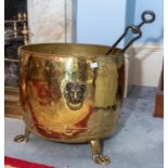 A brass and copper riveted log bin, 20th century, on three hairy lion paw feet, 40cm high