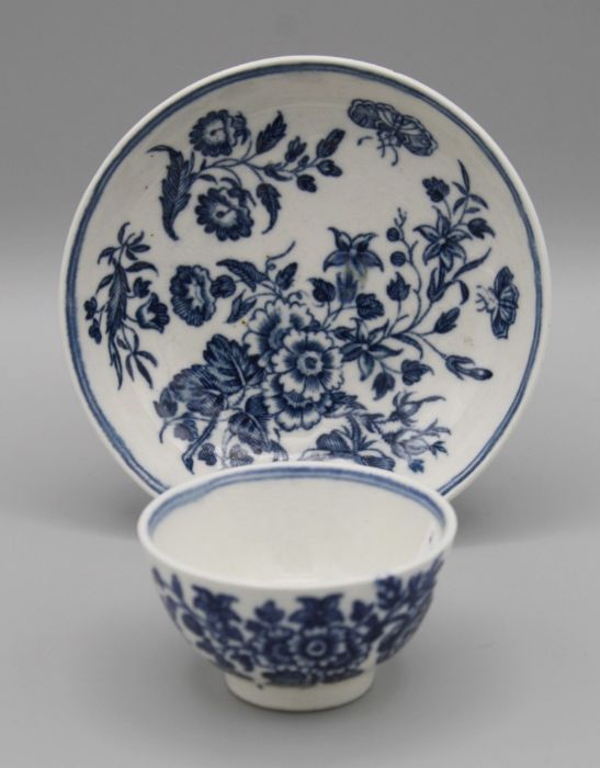 An 18th century Worcester miniature tea bowl and saucer, decorated underglaze with Rose pattern,