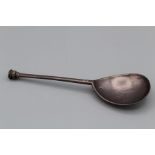 An Edward VI silver seal top spoon, the wide fronted hexagonal stem incised IH, makers mark worn,