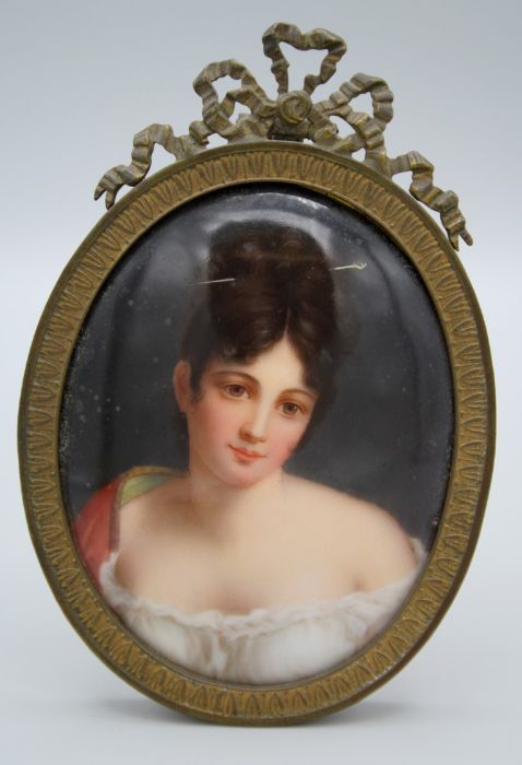 A 19th century German porcelain plaque, painted in polychrome enamels with a bust length portrait of