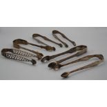 William Cripps, a pair of early George III silver openwork sugar tongs, shell bowls and climbing