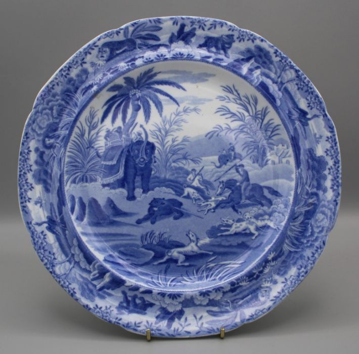 An early 19th century Spode blue and white pottery plate, printed with Death of the Bear pattern.