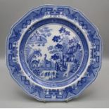 An early 19th century blue and white pottery plate, printed underglaze with an Oriental garden,