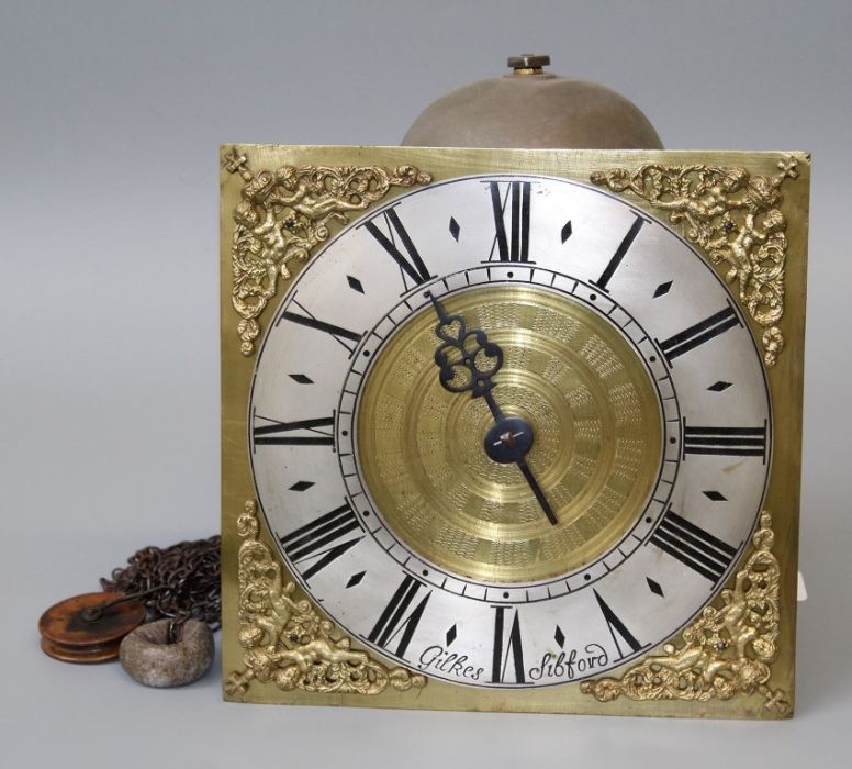 Gilkes, Sibford, hook (hoop) and spike thirty hour wall clock with single hand and 10'' brass