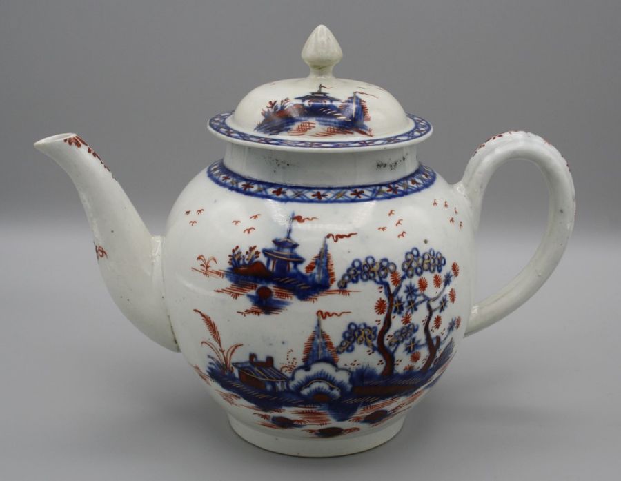 An 18th century Penningtons Liverpool teapot and cover, decorated in underglaze blue, overglaze iron