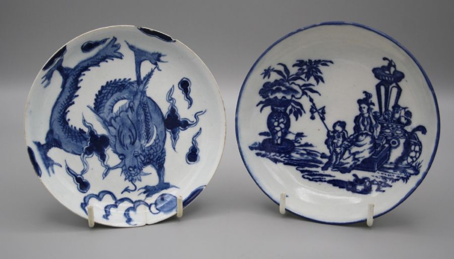 An 18th century Bow porcelain saucer decorated with a dragon in underglaze blue, 12.5cm (faults)