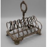Robert Hennell, a George IV silver toast rack, the gadrooned ring handle over seven divisions,