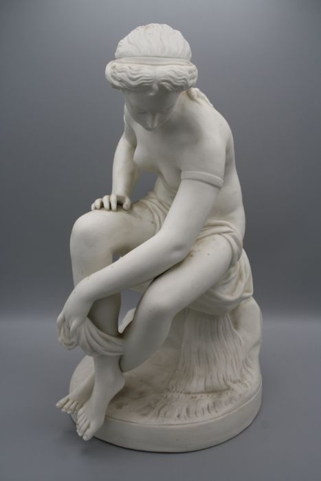 A 19th century English parian figure of a female nude, seated upon a rock, drying with a robe, - Bild 2 aus 12