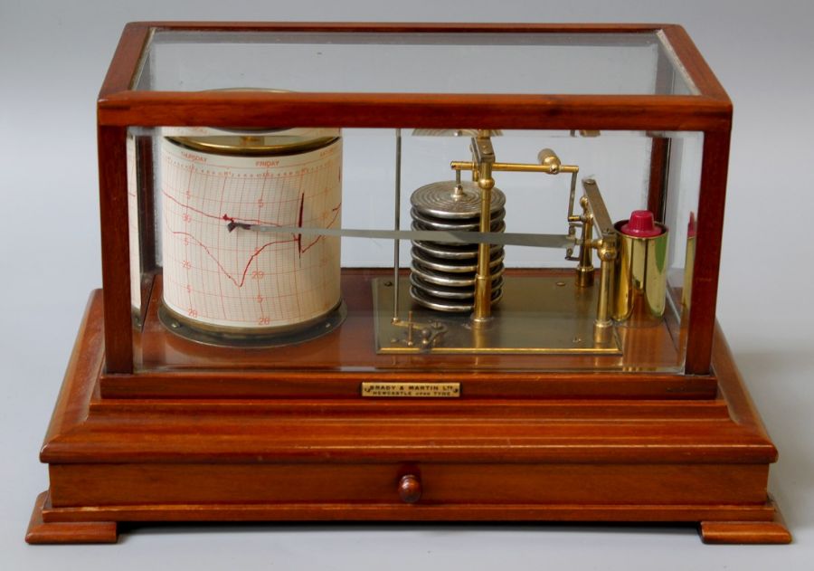 Brady and Martin Ltd, an Edwardian mahogany and five glass cased barograph, French eight day