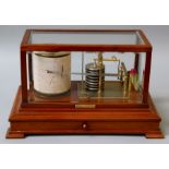 Brady and Martin Ltd, an Edwardian mahogany and five glass cased barograph, French eight day