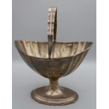 Daniel Egan, an Irish silver sugar basket, shaped swing handle, boat shape body with lion rampant