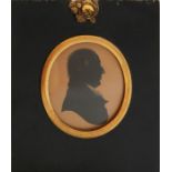 An early 19th century silhouette profile portrait of a Gentleman. Inscribed verso ' Rev Oswald