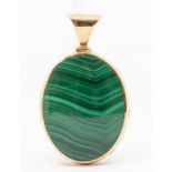 A 9ct gold malachite and quartz reversible pendant, oval shaped form with large bail to top, feature