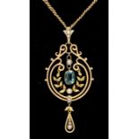 An Edwardian 15ct gold pearl and tourmaline set drop pendant, the wirework form decorated with