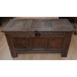 Late 18th Century oak coffer, carving above three panels