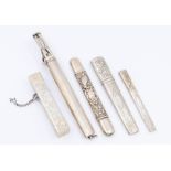 A collection of five silver or white metal bodkin cases (needle cases), various designs and