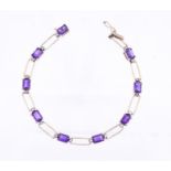 A fancy link amethyst and diamond set 9ct gold bracelet, comprising alternate open wire links and