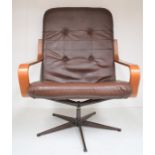 Late 1960s / 1970s button back leatherette brown and teak lounge swivel chair
