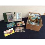 A collection of mid to late 20th Century postcards and TV Stars book, in albums and loose examples