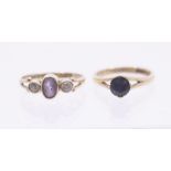 Two 9ct gold stone set dress rings, comprising a sapphire set solitaire, size I1/2, and an