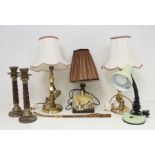 A pair of brass candle lamps, candlesticks, a wooden Goldschrieder (?) lamp and a shoe horn