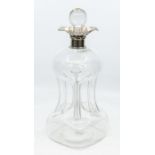 An Edwardian silver mounted clear glass glug decanter, with plain silver collar and floral shaped