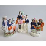 A small group of Three Staffordshire Pastoral Figures of Boys and Girls, one pair with a rabbit