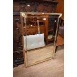 A modern gilt wall mirror