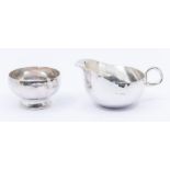 A Modern matched silver milk jug and sugar bowl, hammered bodies, hallmarked by JND & RMC, London,