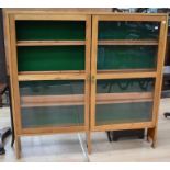 Light oak slender three shelf glazed display cabinet