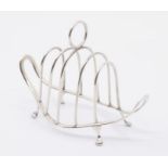 A late Victorian ornate five bar toast rack, on four paw feet, hallmarked Birmingham, 1896, approx