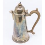 A Queen Anne style silver coffee / hot water jug, plain body, domed cover, bakelite handle and