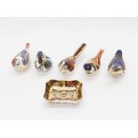 Three Royal Crown Derby bird gold stopper paperweights, two bird silver stopper paperweights and a