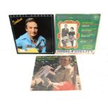 A collection of vinyl records to include John Loudermilk, Carter Family, Lonnie Donegan, Faron