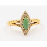 A diamond and turquoise type 18ct gold ring, comprising a marquise shaped setting, turquoise set
