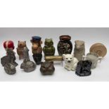 A collection of early to late 20th Century money boxes in metal, ceramics and plastics