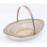 An Edwardian silver swing handled fruit  basket, shaped oval with gadroon, rocaille and scroll