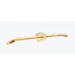 Horse Interest- A Garrard & Co 18ct two tone gold rising crop brooch with horse shoe detail,