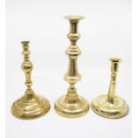 A trio of 19th Century brass candlesticks