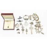 A collection of jewellery to include silver and white metal, including a charm bracelet, patch