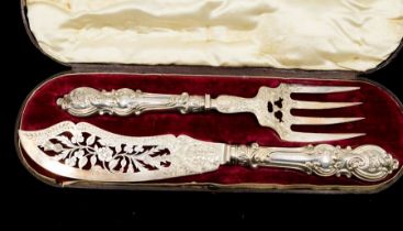 A pair of Victorian silver fish servers, the blade engraved with thistle, shamrock and roses