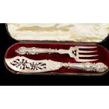 A pair of Victorian silver fish servers, the blade engraved with thistle, shamrock and roses