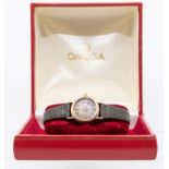 Omega- a 9ct gold ladies wristwatch, comprising a round bronze tone dial with applied baton markers,
