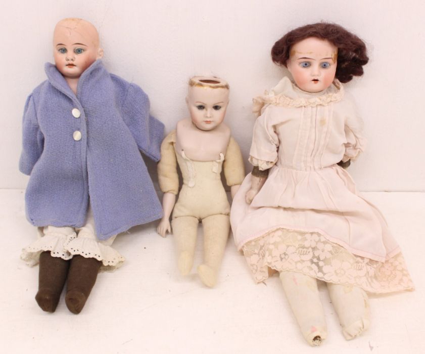 Dolls: A pair of bisque head dolls, kid bodies, fixed eyes, open mouths. Fingers have sustained