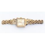 A ladies 9ct gold Rotary wristwatch,  square champagne dial with applied baton markers, case