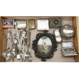 A collection of plated teaspoons, table salt compact and vesta cases