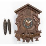A two-train Black Forest cuckoo clock. No pendulum, 3 inch dial. 11 ins high x 8 ins wide x 6 ins