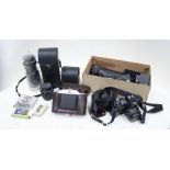 A collection of vintage cameras with accessories, including also tea/cigarette cards