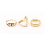 Three 9ct gold rings to include an opal and sapphire three stone ring, size U, (misshaped) a wedding